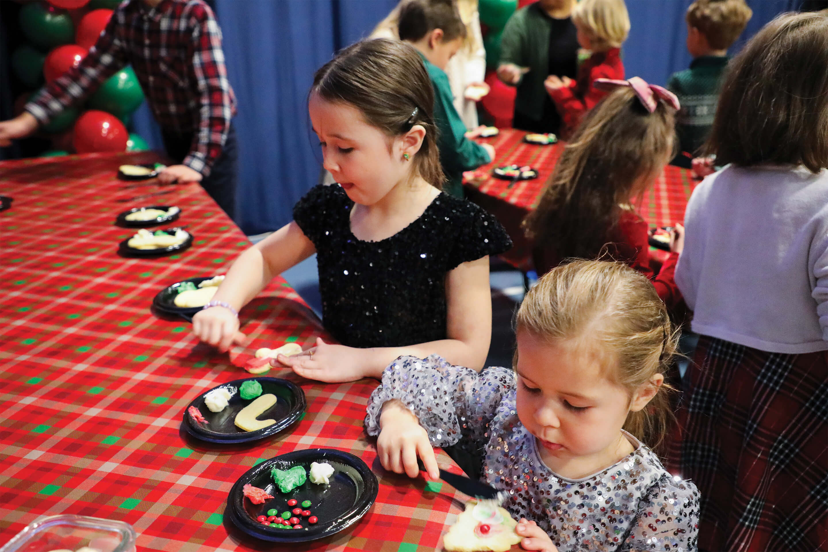 St. Tikhon's Seminary Community seminary children decorating cookies together.
